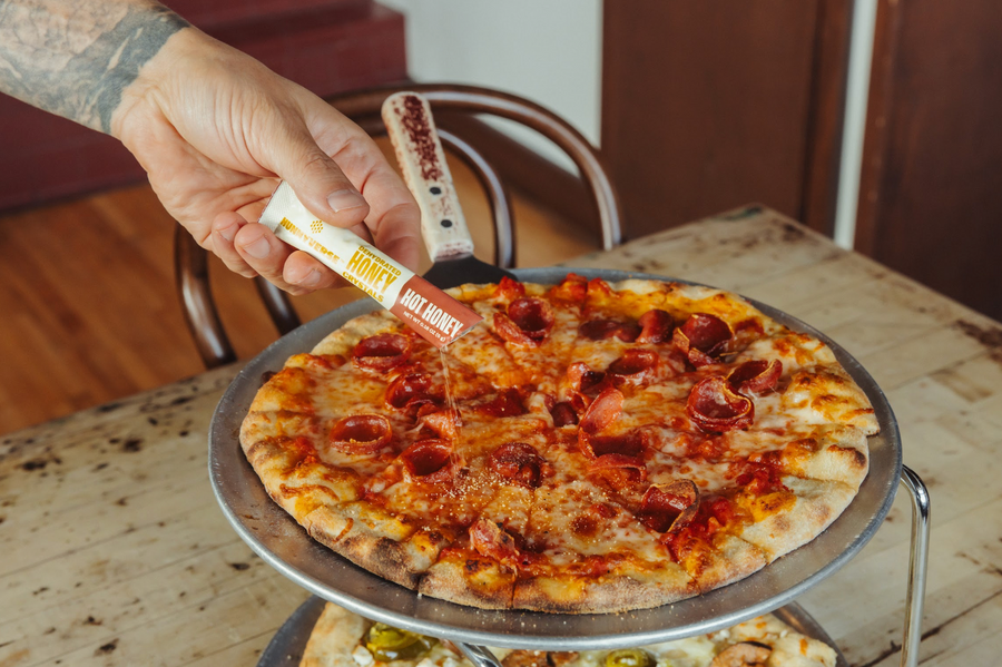 hot honey crystals sprinkled on pizza
