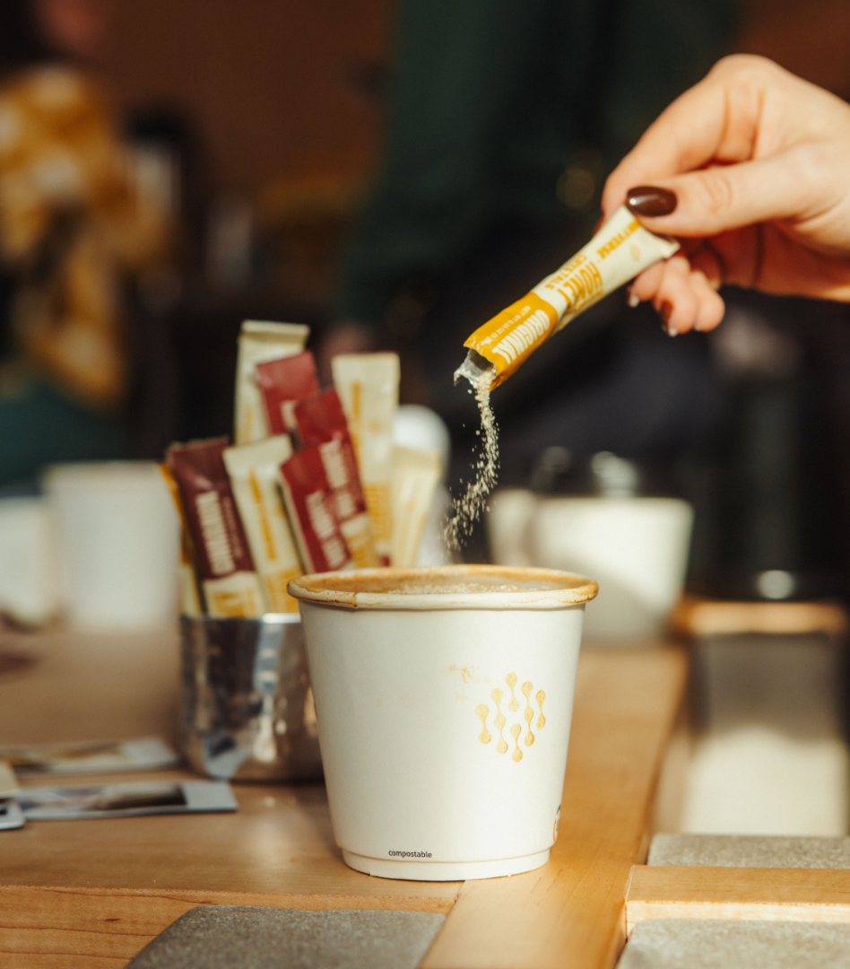 honey crystals dissolving in coffee